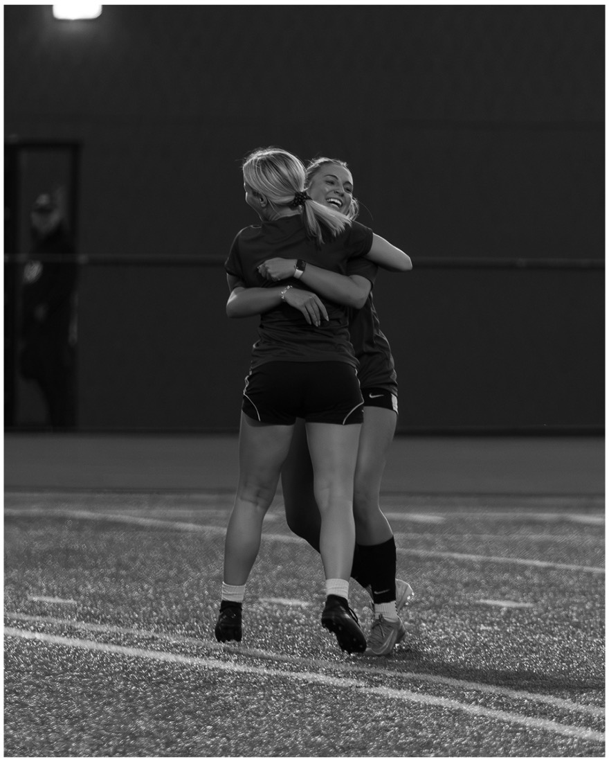 Players celebrating in black and white