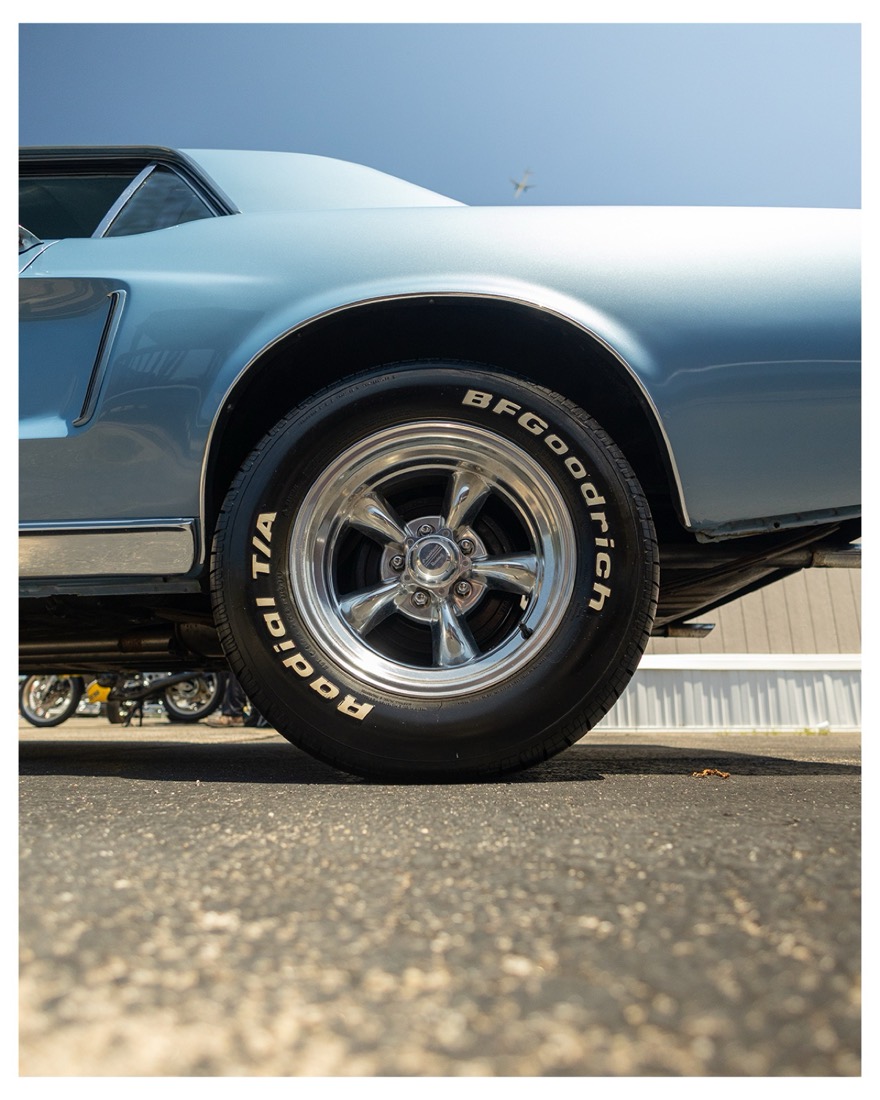 Vintage sports car wheel in the sun
